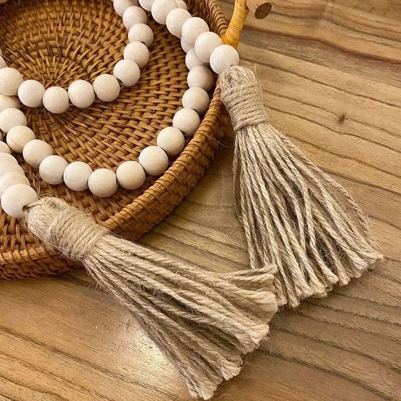 The Bead Garland — wooden beads on cotton cord with tassel ends